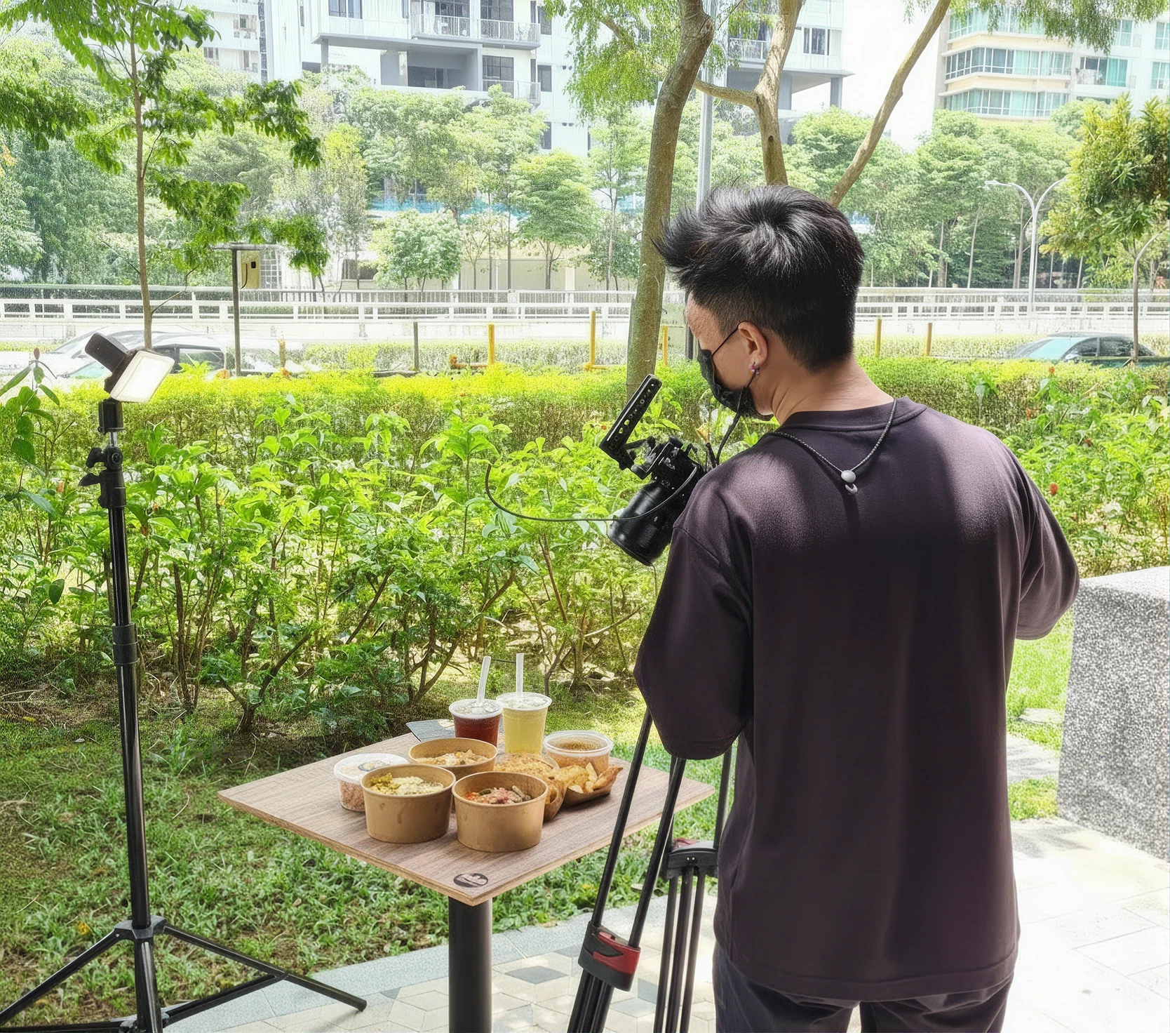 A mobile ordering experience being filmed outdoors beside a meal